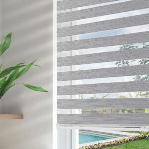 Joydeco elegant home interior display highlighting high-performance grey zebra roller blinds fitted clean over a bedroom window.