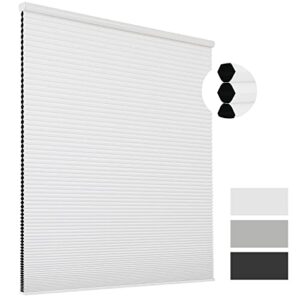 Luxury modern interior featuring high-quality white cellular blackout shade hung over a large patio doorway.
