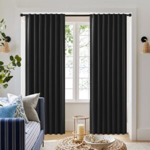 Sleek architectural living zone highlighting how a high-quality set of black curtains back tab offers complete glare protection.