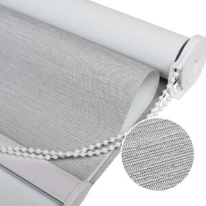 Luxury modern interior featuring high-quality light grey blackout shade hung over a large patio doorway.