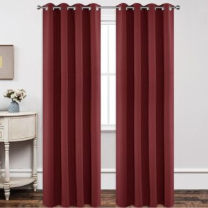 Close-up fabric macro visual highlighting the heavy drape and neat weave of a hung blackout burgundy curtain.