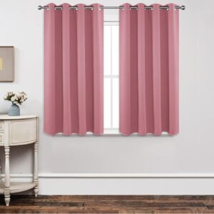 Joydeco tailored window treatment displaying an elegant blackout light pink curtain installed over a clean casual setting.