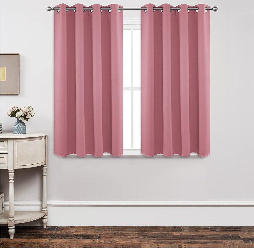Joydeco Custom Blackout Back Tab Rod Pocket Curtain - Light Pink 1 Joydeco tailored window treatment displaying an elegant blackout light pink curtain installed over a clean casual setting.