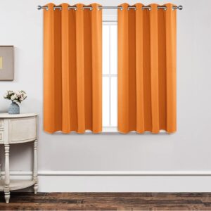 Modern apartment window arrangement showing how a custom blackout orange curtain provides excellent daily shade control.