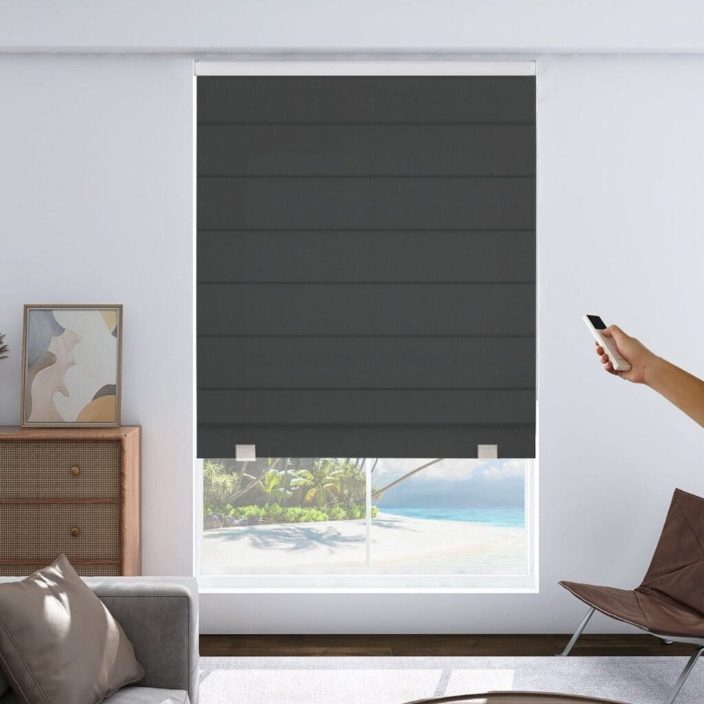 Modern automated smart home windows featuring high-quality blackout roman shade motorized grey installed in a bright modern workspace.