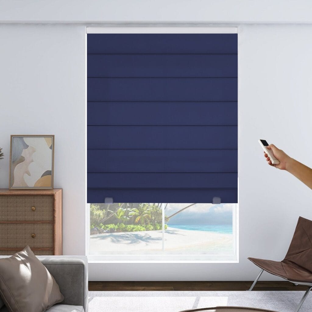 Joydeco custom motorized window treatment option showing an integrated roman shade motorized navy blue setup over clean wall decor.