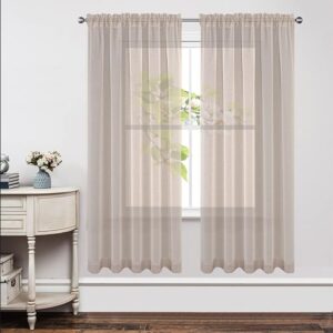 Nicely dressed home office layout focusing on the subtle weave pattern of a tailored linen sheer curtain.