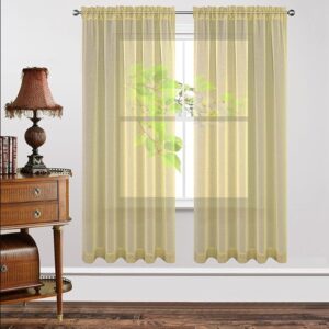 Nicely dressed home office layout focusing on the subtle weave pattern of a tailored yellow sheer curtain.