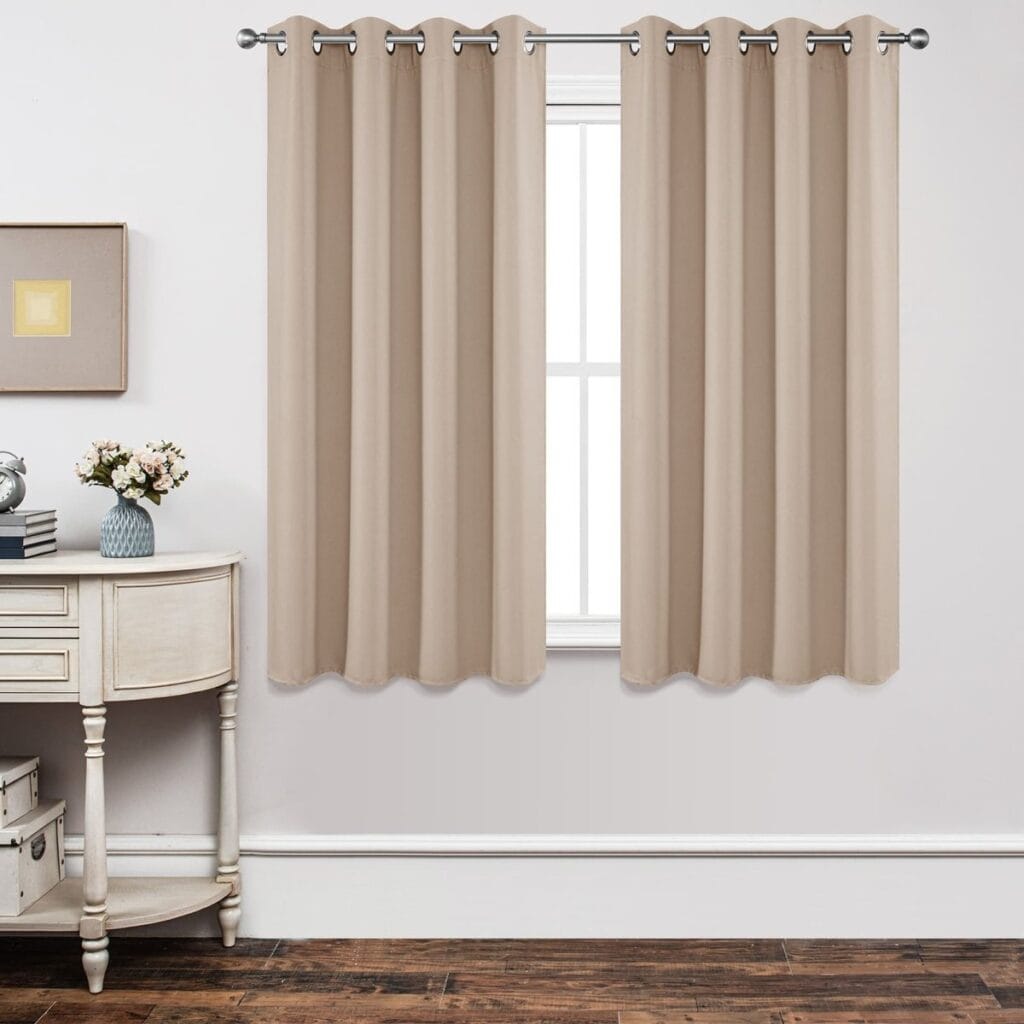 Sleek architectural window frame showcasing how custom light beige thermal curtain provide excellent daily coverage.