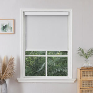 Joydeco custom motorized window treatment option showing an integrated traditional blackout silver setup over clean wall decor.