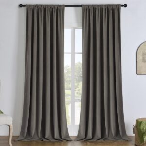A wide residential patio door dressed beautifully with custom dark grey velvet curtain in a sunlit dining area.