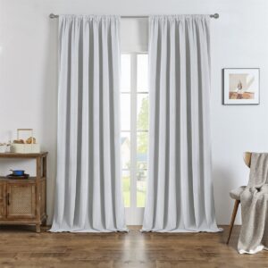 A tailored residential window layout showcasing beautiful blackout curtain ivory white installed cleanly across a sunlit room.