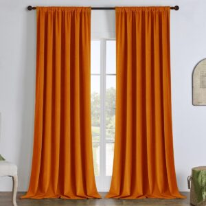 Joydeco functional home visual emphasizing an elegant velvet blackout orange hanging gracefully over a minimalist setting.