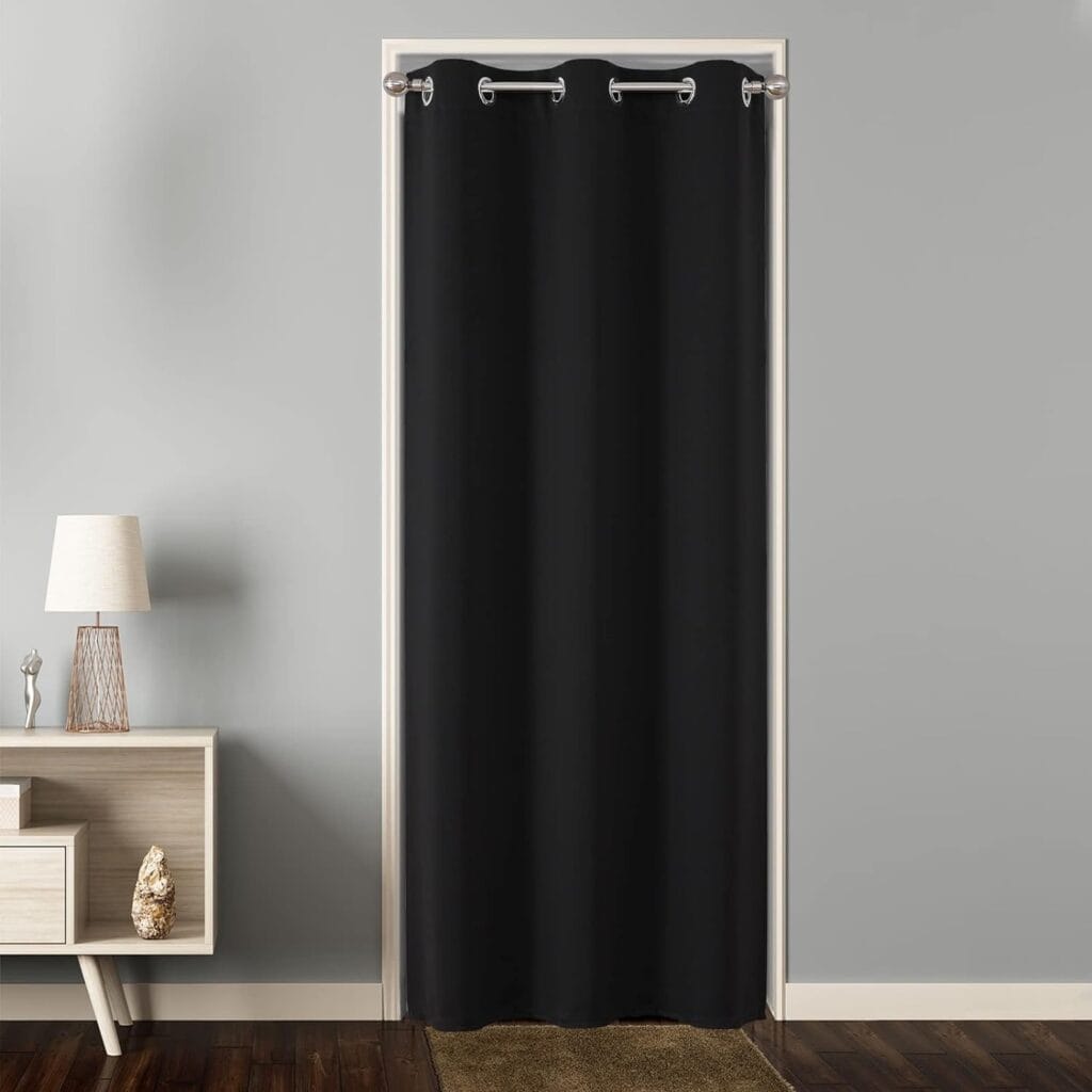 Polished farmhouse layout showing how premium extra wide black curtains gracefully filter daylight into a reading nook.