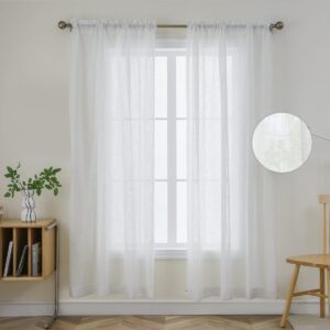 Sleek architectural setup showcasing how a set of functional white floral sheer curtains separates spaces and prevents outside drafts.