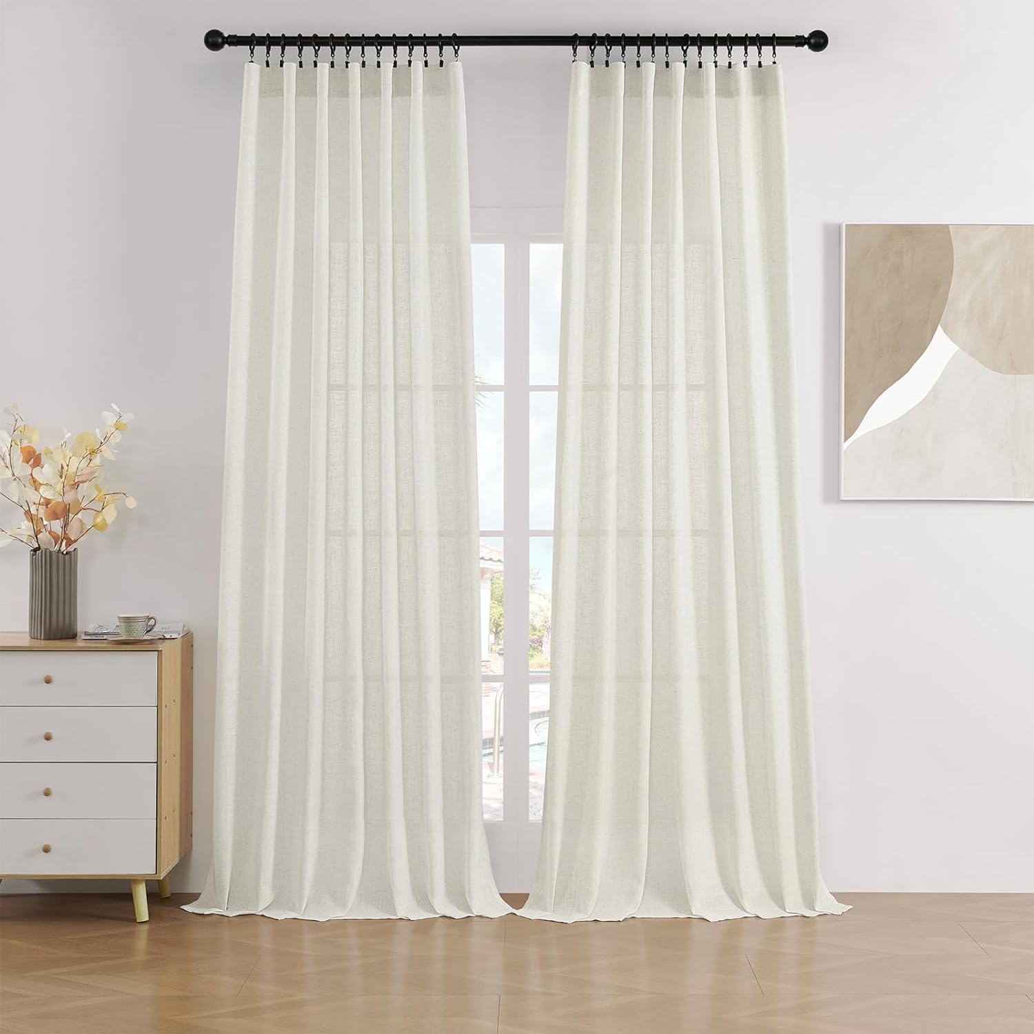 Joydeco Linen Light Filtering Curtains for Living Room, 2-Panel Set - Cream 1 Polished living room setup showing how a set of integrated cream light filter curtains provides excellent sun glare coverage.