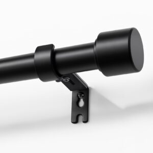 Joydeco elegant home interior display highlighting high-quality modern black curtain rod cascading beautifully over a window setting.