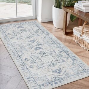 A decorative home layout emphasizing a beautiful washable runner rug blue grey laid down neatly across an elegant entryway corridor.