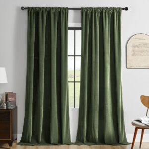 Elegantly draped window display focusing on the clean lines of olive velvet blackout curtains framing a scenic backyard view.