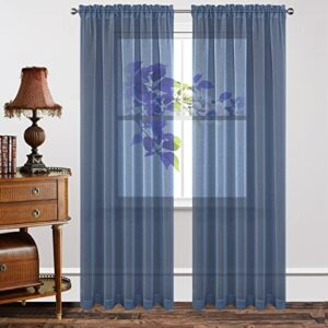 Sleek architectural doorway presentation featuring the elegant long hang profile of a custom-tailored navy blue sheer curtains.
