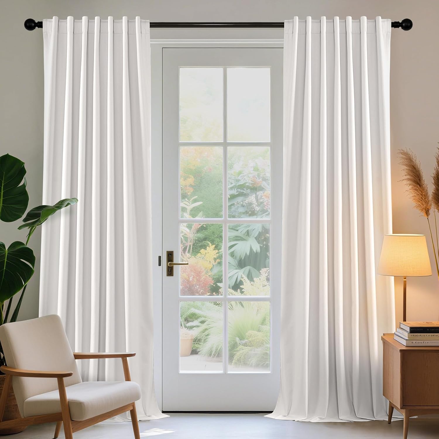 Joydeco Semi-Blackout Farmhouse Curtains & Drapes for Living Room, 2-Panel Set - Pure White 1 Joydeco elegant home interior display highlighting high-quality white farmhouse curtains cascading beautifully over a window setting.