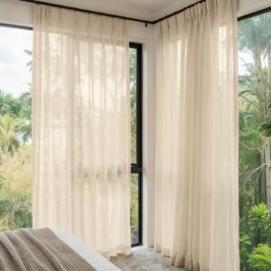 Polished apartment layout focusing on the crisp horizontal fall profile of a tailored linen sheer curtains oatmeal set.
