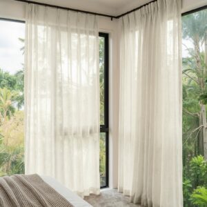 Polished apartment layout focusing on the crisp horizontal fall profile of a tailored linen sheer curtains off white set.