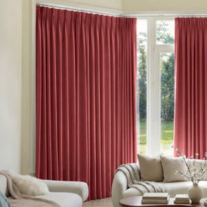 Joydeco tailored window treatment presentation highlighting premium blackout curtain burgundy red setup over a clean living room setting.