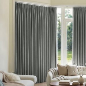 Sleek architectural living zone showcasing how an integrated blackout curtains dark grey setup filters intense direct afternoon solar rays.