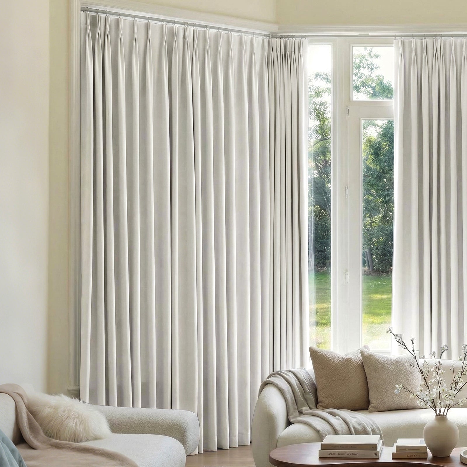 Mason Triple Weave Blackout Curtain - Ivory White 1 A modern well-lit living area featuring an elegant blackout curtains ivory white filtering daylight beautifully.