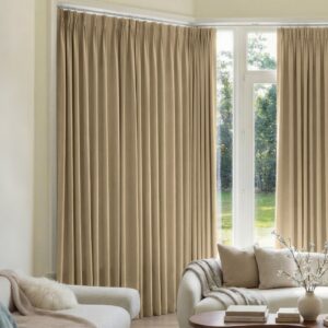 Joydeco tailored window treatment presentation highlighting premium blackout curtain light beige setup over a clean living room setting.