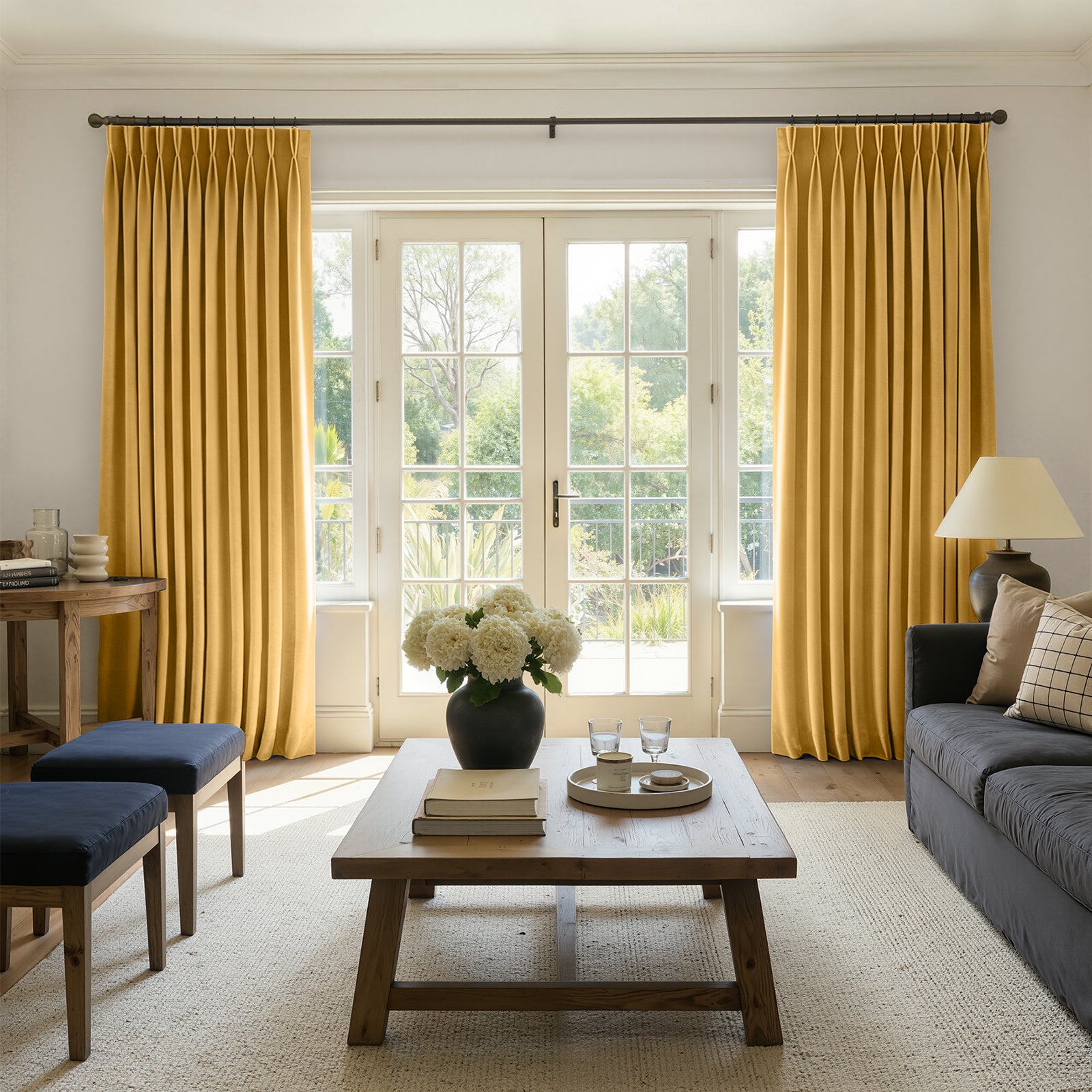 Sloane Velvet Room Darkening Curtain - Egg Yellow 1 A modern well-lit living area featuring an elegant darkening curtain egg yellow filtering daylight beautifully.