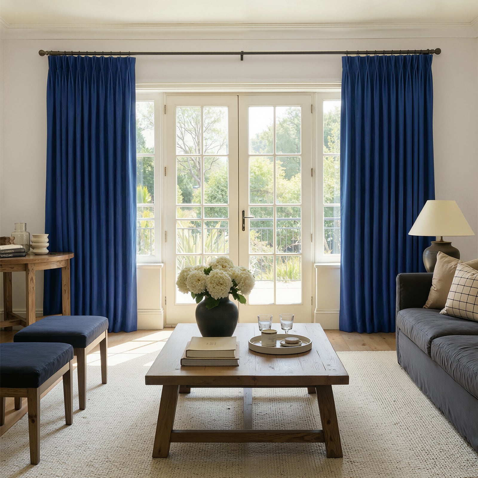 Sloane Velvet Room Darkening Curtain - Navy Blue 1 Polished apartment layout focusing on the crisp horizontal fall profile of a tailored darkening curtain navy blue set.