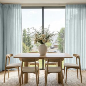 Sleek architectural space highlighting how an integrated linen sheer curtain ebony grey installation handles incoming reflections gracefully.