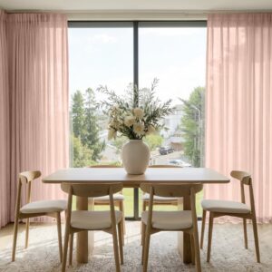 A modern well-lit living area featuring an elegant linen sheer curtain pink beige filtering daylight beautifully.