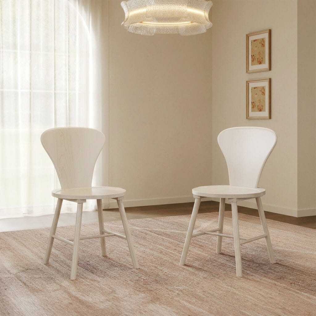 The Sicotas Collection 36 Pair of Sicotas Cas white alder round dining chair set models styled elegantly inside a modern dining area.