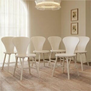 Refined dining room featuring round dining chair set in white alder with natural warmth.