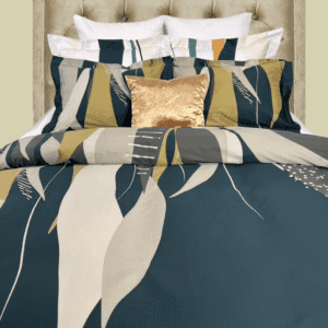 green duvet cover photographed with coordinated bedding