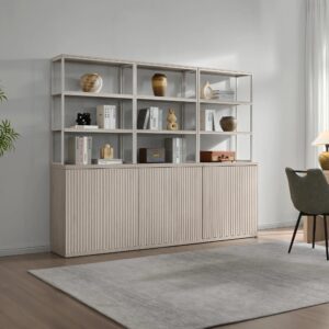 Refined living area featuring bookcase with doors in white alder and elegant storage.