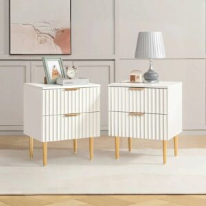 Stylish bedroom featuring nightstand table set in white with clean lines.