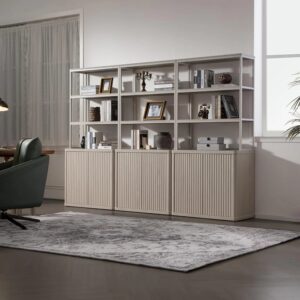 Cozy room highlighting bookcase with storage in white alder and open shelving.