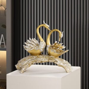 Elegant gold swan sculpture decor adding charm and artistry to any living space.
