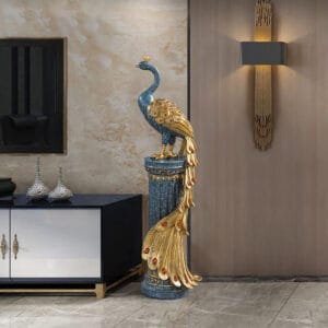 Luxurious resin peacock floor sculpture decor glowing with gold and emerald hues.