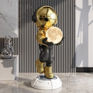 Luxurious black and gold astronaut floor lamp ornament featuring a glowing moon globe.