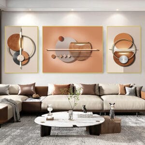 Three framed canvas prints featuring warm geometric abstract wall decor in gold and orange tones.