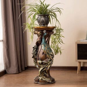 Showcase your plants on this rustic peacock plant stand featuring intricate engravings.