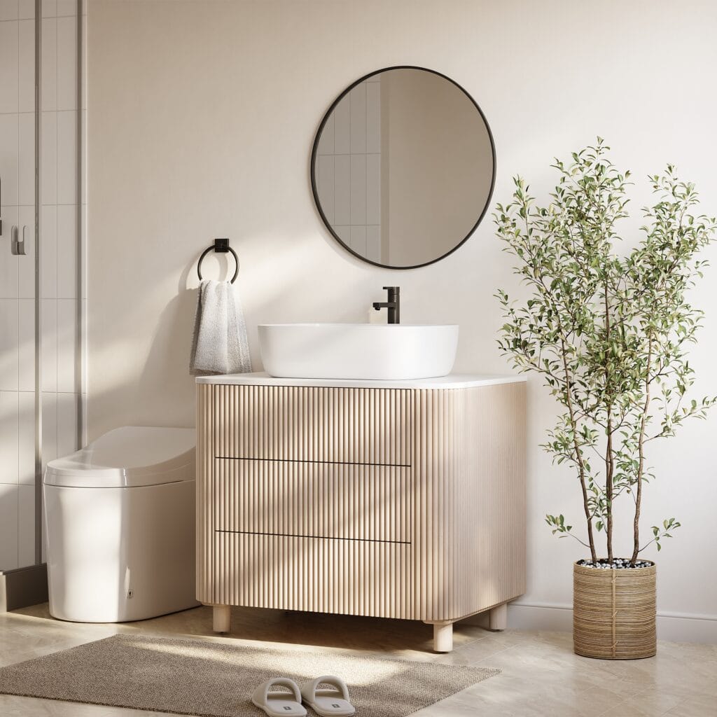 Freestanding bathroom vanity with sink featuring a fluted solid wood base and sintered stone top.