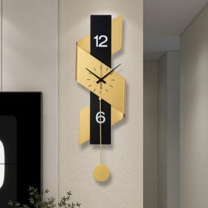 Oversized black and gold digital wall clock featuring a bold ribbon-like frame.