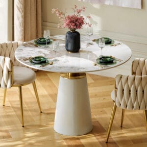 Round Sintered Stone dining table with a leather-wrapped cone base, perfect for gatherings.