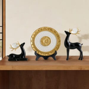 Elegant 3-piece decorative deer plate set featuring hand-painted plate and sculptural deer figurines.